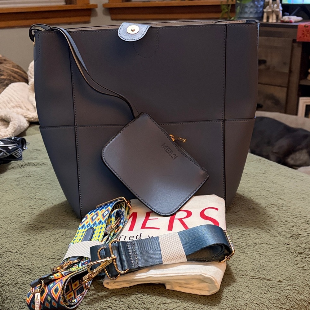 Beautiful blue Mersi cross body bucket bag.